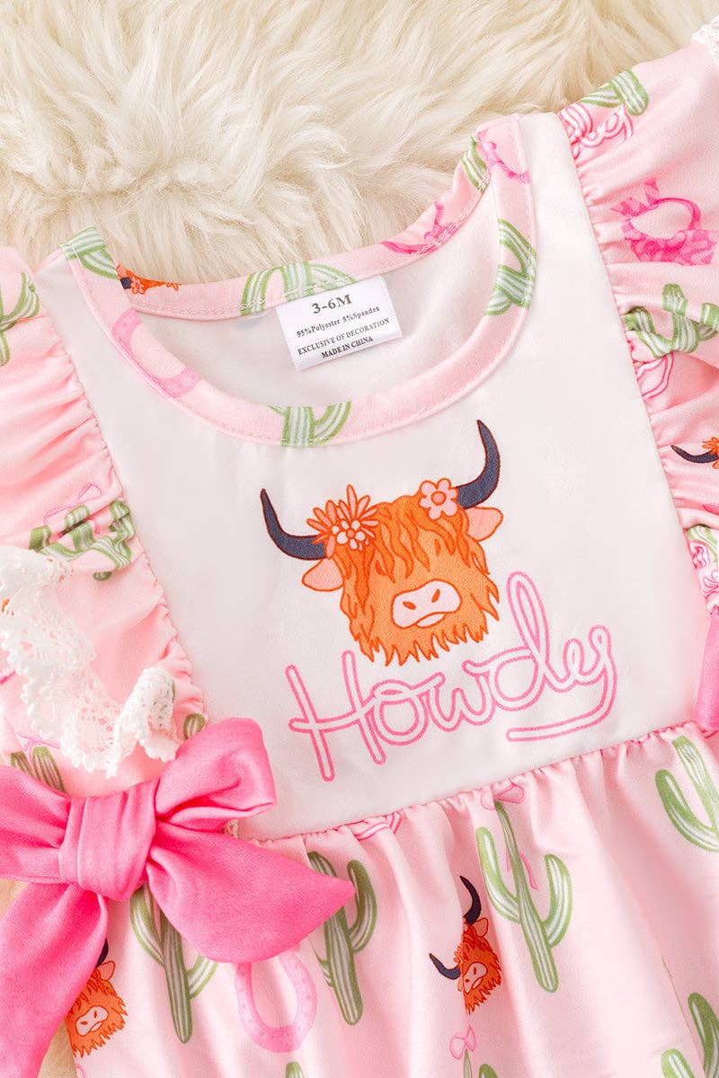 "Howdy" Highland cow printed girls romper w/side bows.