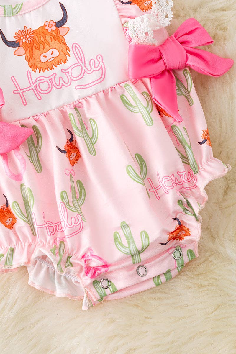 "Howdy" Highland cow printed girls romper w/side bows.
